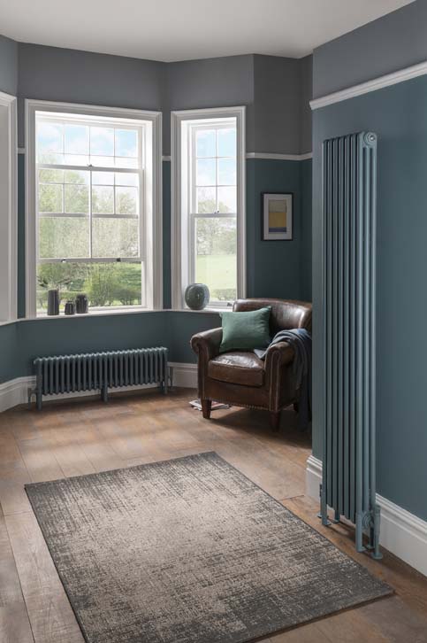 Blue vertical radiator. Stylish interior with colour blocking. 
